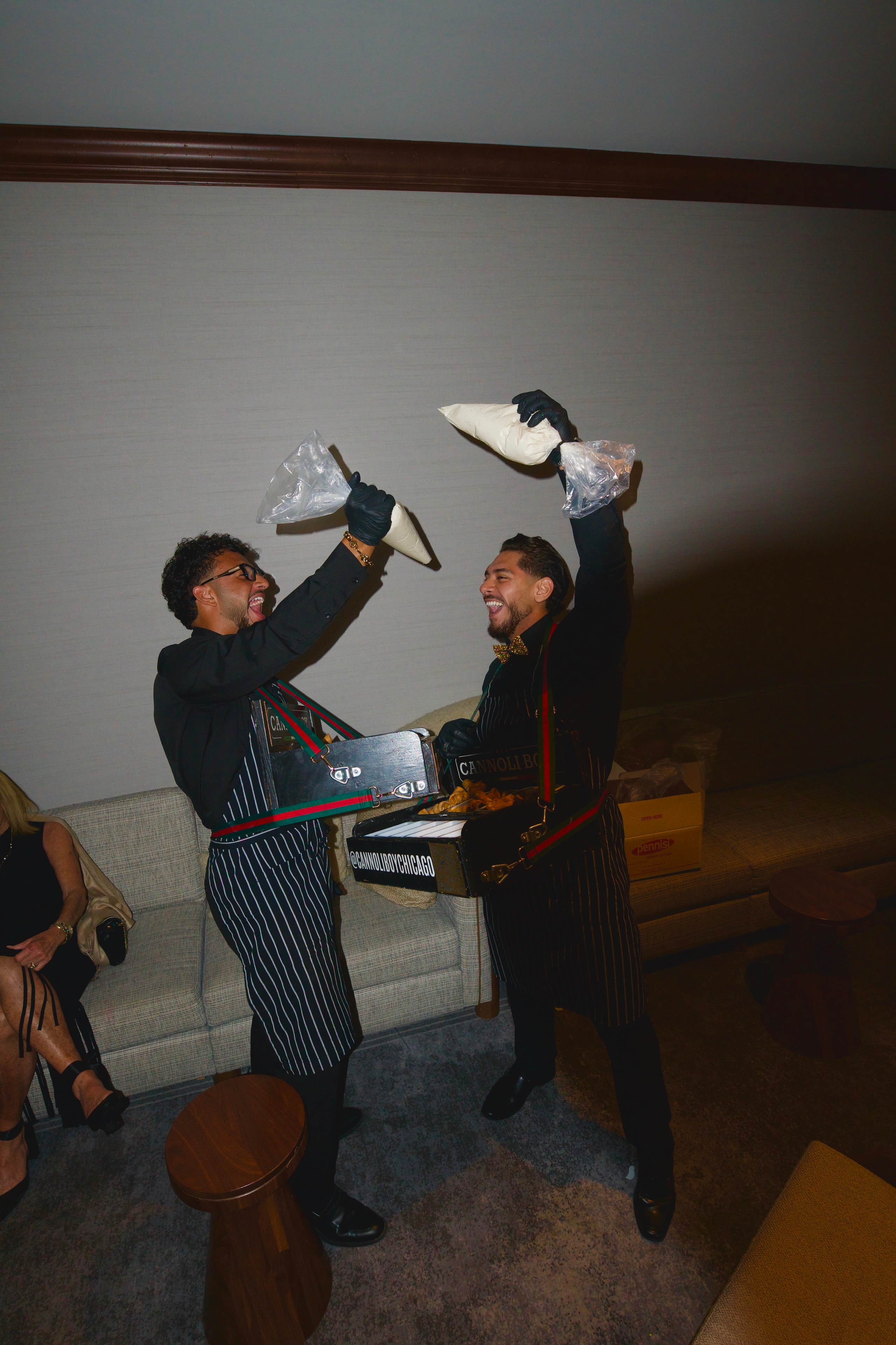 Two men celebrating indoors